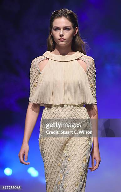 Model walks the runway during the Zareena show at Fashion Forward Spring/Summer 2017 held at the Dubai Design District on October 22, 2016 in Dubai,...