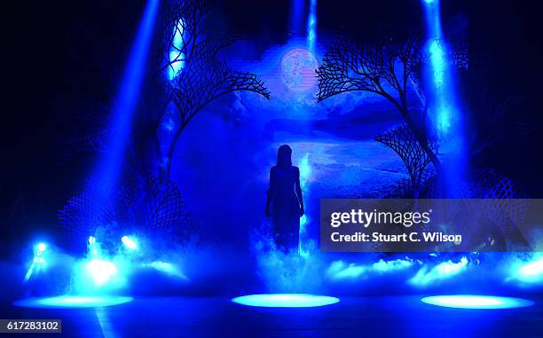 Model walks the runway during the Zareena show at Fashion Forward Spring/Summer 2017 held at the Dubai Design District on October 22, 2016 in Dubai,...