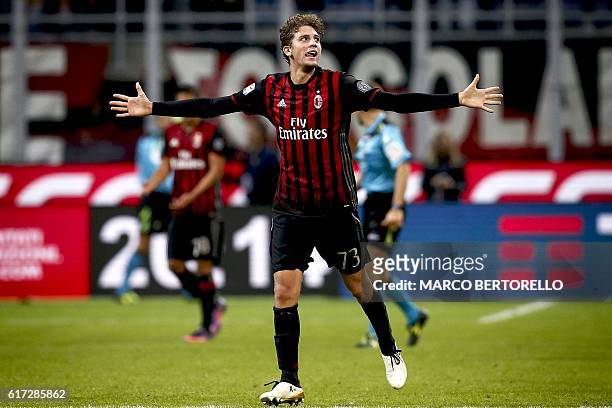 Milan's midfielder Manuel Locatelli celebrates after scoring a goal during the Italian Serie A football match AC Milan versus Juventus on October 22,...