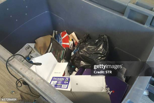 Picture taken on October 22, 2016 shows belongings of employees of the French news channel iTele which were allegedly discarded during the move of...
