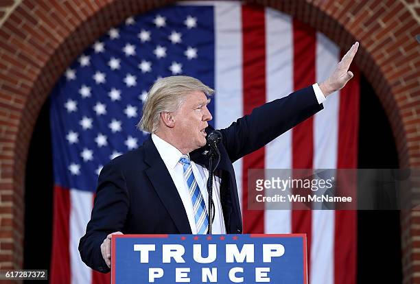 Republican presidential candidate Donald Trump waves to supporters while campaigning at Regent University October 22, 2016 in Virginia Beach,...