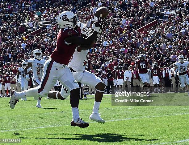Cornerback Isaiah Rodgers of the Massachusetts Minutemen breaks up a pass intended for wide receiver Deebo Samuel of the South Carolina Gamecocks at...