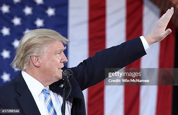 Republican presidential candidate Donald Trump waves to supporters while campaigning at Regent University October 22, 2016 in Virginia Beach,...