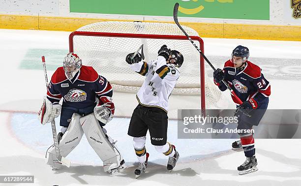 Brock Hill of the Saginaw Spirit takes a high sticking penalty for hitting Alex Formenton of the London Knights in the face during an OHL game at...