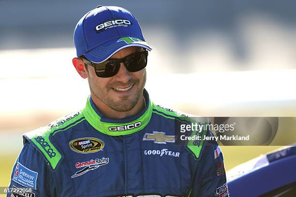 Casey Mears, driver of the GEICO Chevrolet, stands on the grid prior to qualifying for the NASCAR Sprint Cup Series Hellmann's 500 at Talladega...