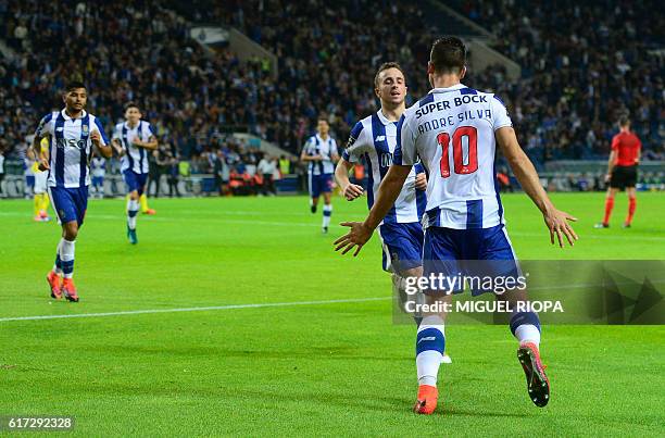 Porto's midfielder Andre Silva celebrates with teammates after scoring a goal during the Portuguese league football match FC Porto vs FC Arouca at...