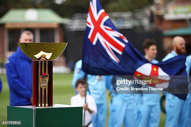 The Matador BBQs One Day Cup stands during the Australian National Anthem prior to the Matador BBQs One Day Cup Final match between Queensland and...