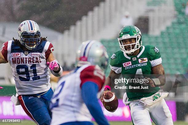 Darian Durant of the Saskatchewan Roughriders runs with the ball on his way to scoring a touchdown in the game between the Montreal Alouettes and...