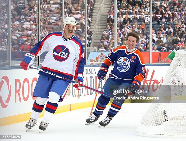 Dave Babych of the Winnipeg Jets alumni and Wayne Gretzky of the Edmonton Oilers alumni warm up during the 2016 Tim Hortons NHL Heritage Classic...