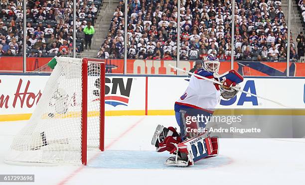 Edmonton Oilers alumni get the puck past Bob Essensa of the Winnipeg Jets alumni during the 2016 Tim Hortons NHL Heritage Classic alumni game at...