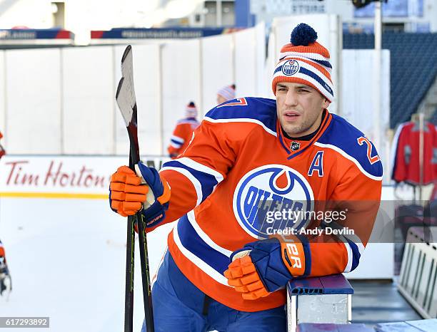 Milan Lucic of the Edmonton Oilers takes a break during practice in advance of the 2016 Tim Hortons NHL Heritage Classic game at Investors Group...