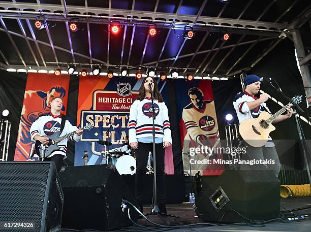 Almost Famous perform in in Spectator Plaza in advance of the 2016 Tim Hortons NHL Heritage Classic alumni game at Investors Group Field on October...