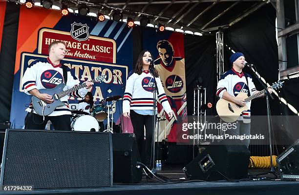 Almost Famous perform in in Spectator Plaza in advance of the 2016 Tim Hortons NHL Heritage Classic alumni game at Investors Group Field on October...