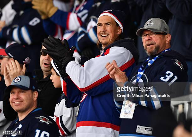Fans cheer on Edmonton Oilers and Winnipeg Jets alumni during the 2016 Tim Hortons NHL Heritage Classic alumni game at Investors Group Field on...