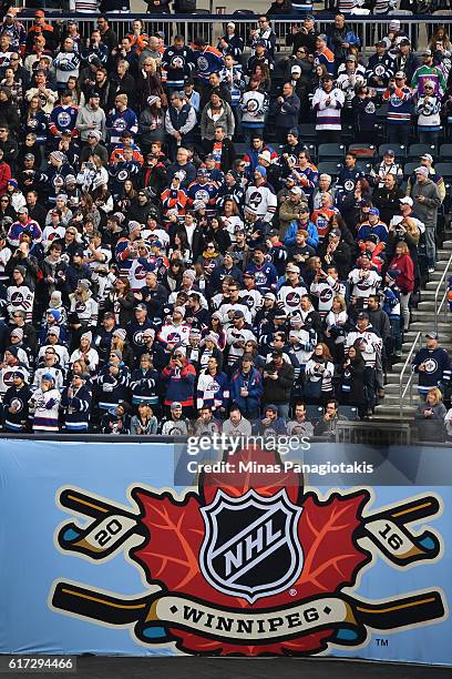 Fans cheer on Edmonton Oilers and Winnipeg Jets alumni during the 2016 Tim Hortons NHL Heritage Classic alumni game at Investors Group Field on...