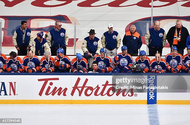 Edmonton Oilers alumni take a break on the bench during the 2016 Tim Hortons NHL Heritage Classic alumni game at Investors Group Field on October 22,...