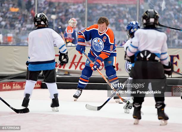 Wayne Gretzky of the Edmonton Oilers alumni plays with kids from the TimBits Hockey Program during the 2016 Tim Hortons NHL Heritage Classic alumni...