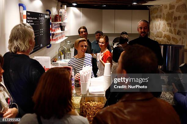 Scarlett Johansson serves patrons during the opening of the Yummy Pop shop where Scarlett Johansson opens the new store Yummy Pop in Le Marais, Paris...