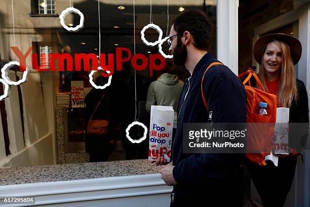 People attend the opening of the Yummy Pop shop where Scarlett Johansson opens the new store Yummy Pop in Le Marais in Paris, on October 22, 2016.