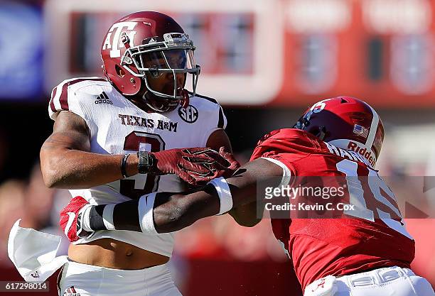 Ronnie Harrison of the Alabama Crimson Tide tackles Christian Kirk of the Texas A&M Aggies at Bryant-Denny Stadium on October 22, 2016 in Tuscaloosa,...