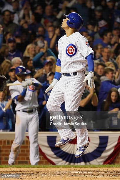 Willson Contreras of the Chicago Cubs celebrates after hitting a solo home run in the fourth inning against the Los Angeles Dodgers during game six...