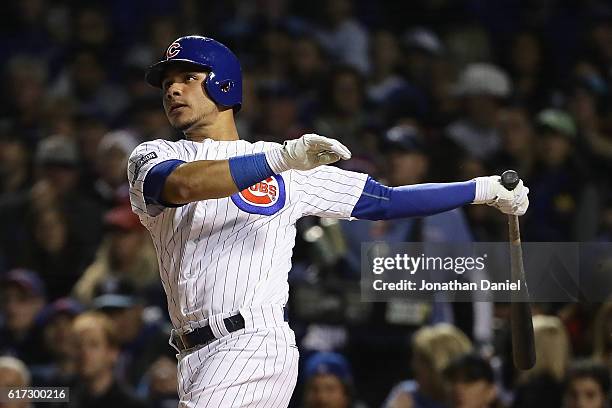 Willson Contreras of the Chicago Cubs hits a solo home run in the fourth inning against the Los Angeles Dodgers during game six of the National...