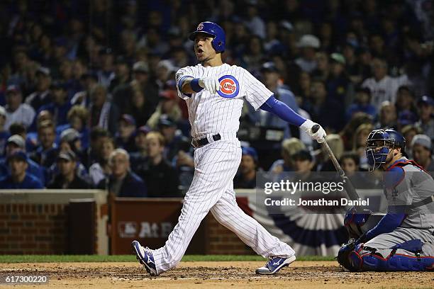 Willson Contreras of the Chicago Cubs hits a solo home run in the fourth inning against the Los Angeles Dodgers during game six of the National...