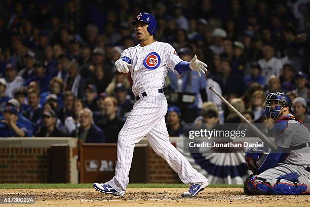 Willson Contreras of the Chicago Cubs hits a solo home run in the fourth inning against the Los Angeles Dodgers during game six of the National...