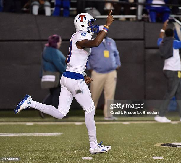 Quarterback Ronald Butler of the Tennessee State Tigers celebrates after throwing a 93 yard touchdown pass against the Vanderbilt Commodores during...