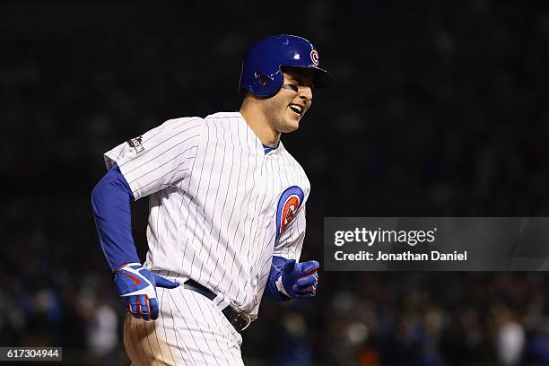 Anthony Rizzo of the Chicago Cubs reacts as he runs the bases after hitting a solo home run in the fifth inning against the Los Angeles Dodgers...