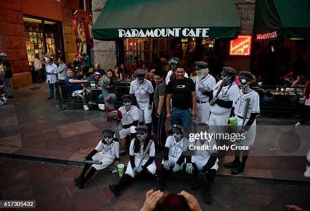 October 22: The Zombie baseball team The Meat Bags, pose for pictures in front of the Paramount Cafe on the 16th St. Mall during the 11th annual...