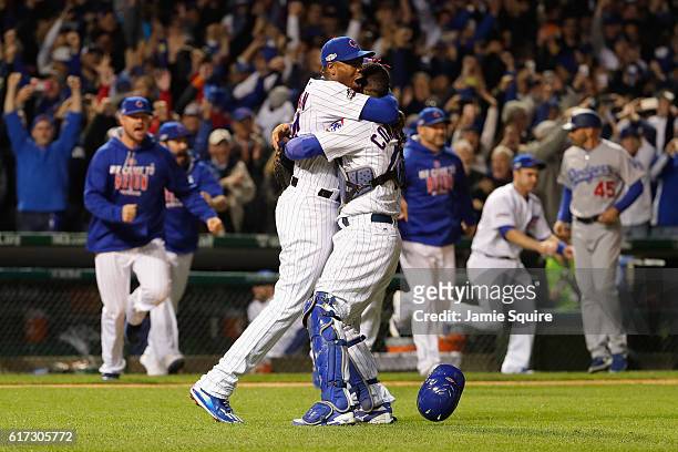 Aroldis Chapman celebrates with Willson Contreras of the Chicago Cubs after defeating the Los Angeles Dodgers 5-0 in game six of the National League...