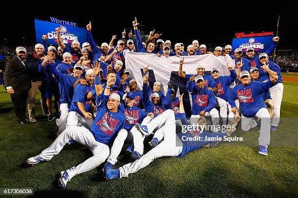 The Chicago Cubs pose after defeating the Los Angeles Dodgers 5-0 in game six of the National League Championship Series to advance to the World...