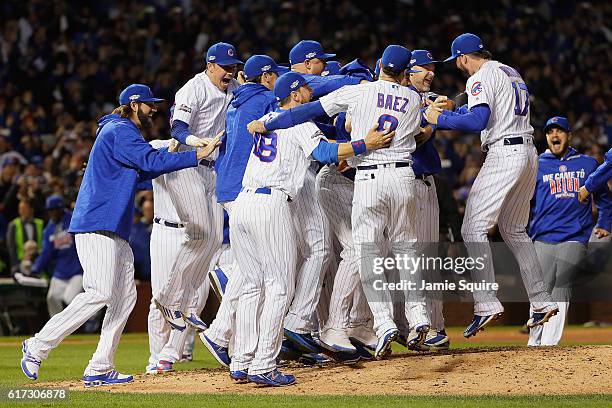 The Chicago Cubs celebrate defeating the Los Angeles Dodgers 5-0 in game six of the National League Championship Series to advance to the World...