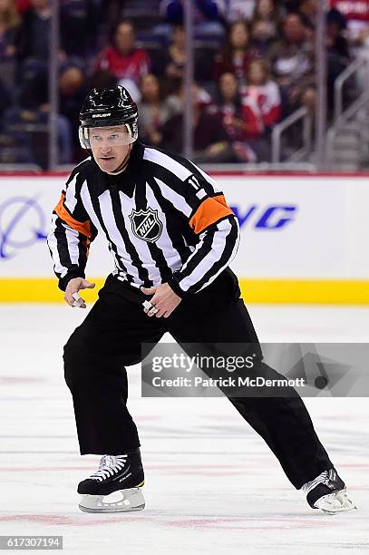 Referee Kelly Sutherland skates in the second period during a NHL game between the New York Rangers and Washington Capitals at Verizon Center on...