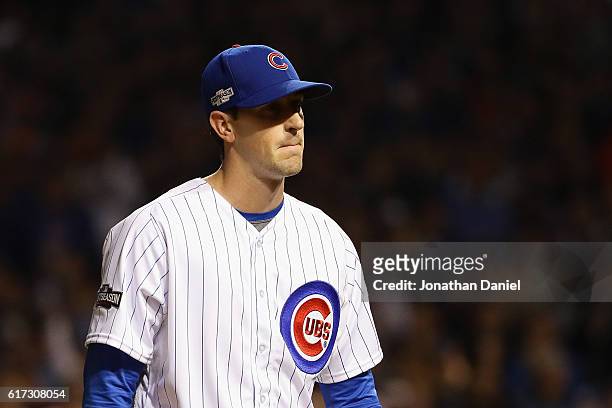 Kyle Hendricks of the Chicago Cubs walks back to the dugout after being relieved in the eighth inning during game six of the National League...