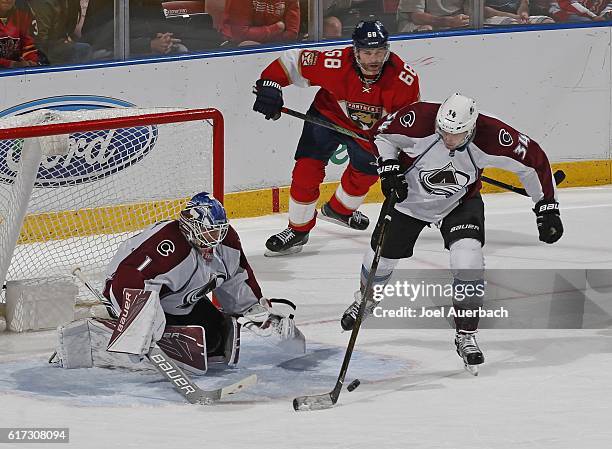 Carl Soderberg clears the puck from in front of Goaltender Semyon Varlamov of the Colorado Avalanche as Jaromir Jagr of the Florida Panthers skates...