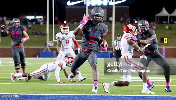 Braeden West of the Southern Methodist Mustangs scores a touchdown against Terrell Williams of the Houston Cougars in the fourth quarter at Gerald J....