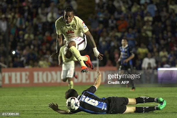Juan Forlin of Queretaro vies for the ball with Michael Arroyo of America during their Mexican Apertura 2016 Tournament football match at La...