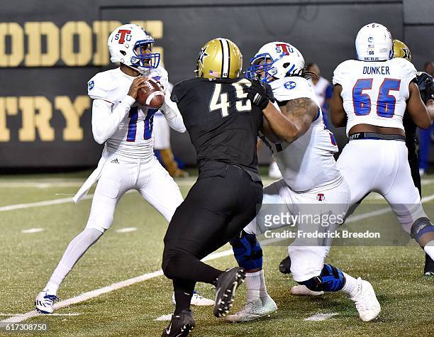Jonathan Wynn of the Vanderbilt Commodores rushes quarterback Ronald Butler of the Tennessee State Tigers during the second half at Vanderbilt...