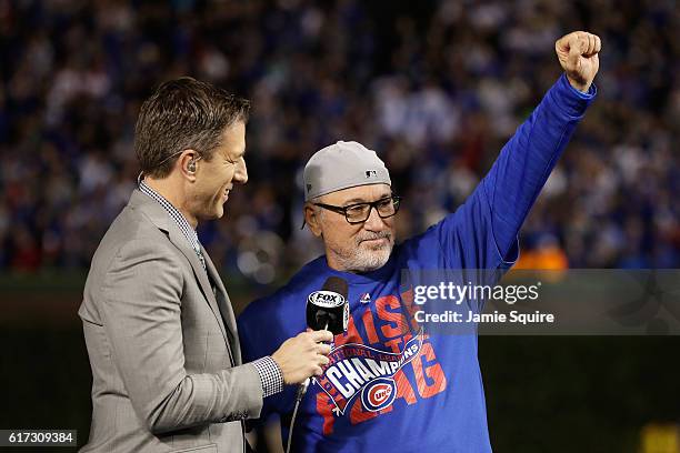 Manager Joe Maddon of the Chicago Cubs celebrates after defeating the Los Angeles Dodgers 5-0 in game six of the National League Championship Series...