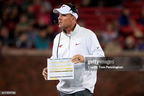 Head coach Chad Morris of the Southern Methodist Mustangs leads the Mustangs against the Houston Cougars in the second half at Gerald J. Ford Stadium...