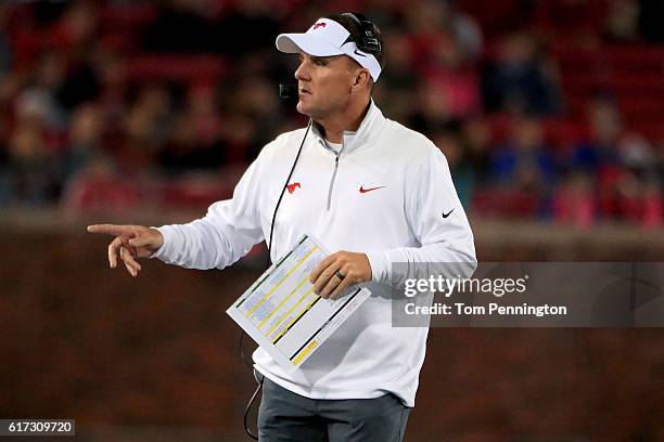 Head coach Chad Morris of the Southern Methodist Mustangs leads the Mustangs against the Houston Cougars in the second half at Gerald J. Ford Stadium...