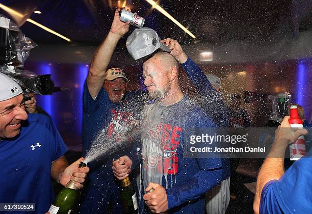 Jon Lester of the Chicago Cubs celebrates in the clubhouse after defeating the Los Angeles Dodgers 5-0 in game six of the National League...