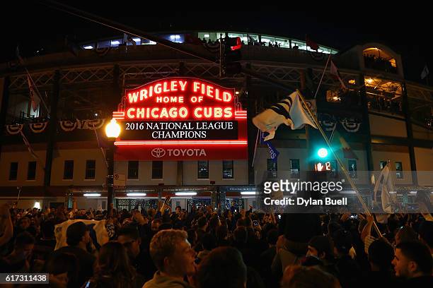 Chicago Cubs fans celebrate outside of Wrigley Field after the Chicago Cubs defeated the Los Angeles Dodgers 5-0 in game six of the National League...
