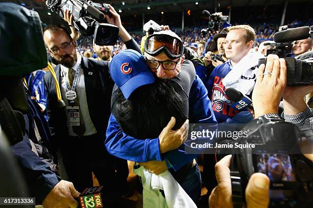 Manager Joe Maddon of the Chicago Cubs celebrates with his wife Jaye Sousoures after defeating the Los Angeles Dodgers 5-0 in game six of the...