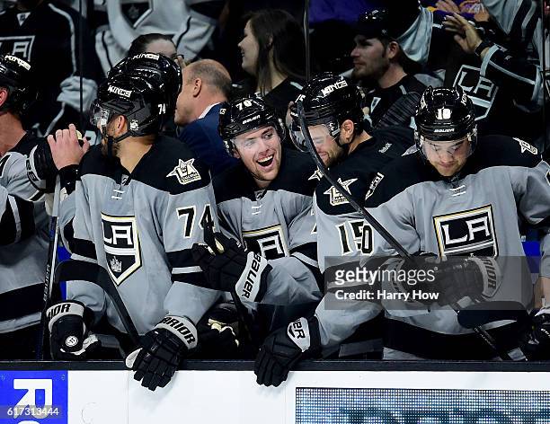 Tanner Pearson of the Los Angeles Kings celebrates his goal on the bench to take the lead during the overtime shootout period against the Vancouver...