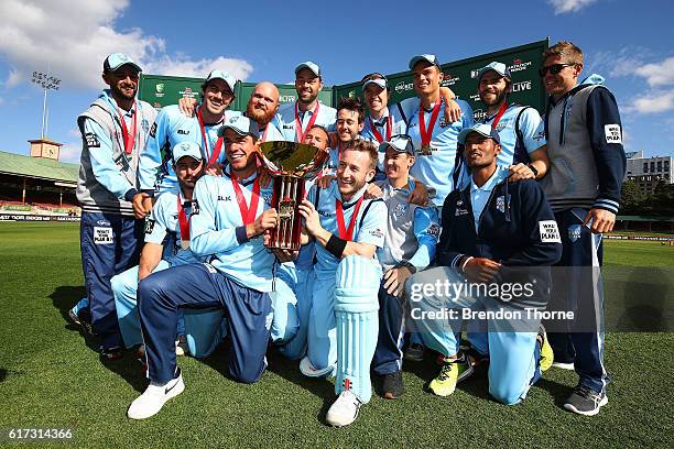 Blues players celebrates with the Matador BBQs One Day Cup after victory in the Matador BBQs One Day Cup Final match between Queensland and New South...