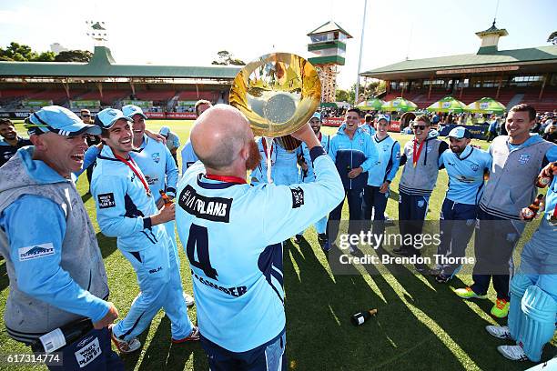 Doug Bollinger of the Blues drinks from the Matador BBQs One Day Cup after victory in the Matador BBQs One Day Cup Final match between Queensland and...