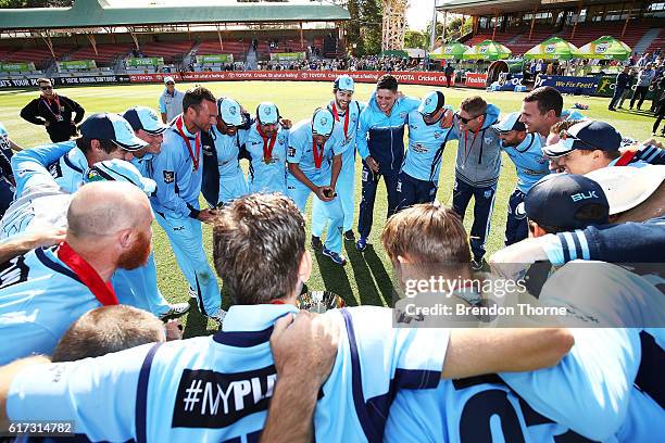 Blues players celebrates with the Matador BBQs One Day Cup after victory in the Matador BBQs One Day Cup Final match between Queensland and New South...